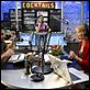 Next Caller : photo Collette Wolfe, Dane Cook, Joy Osmanski